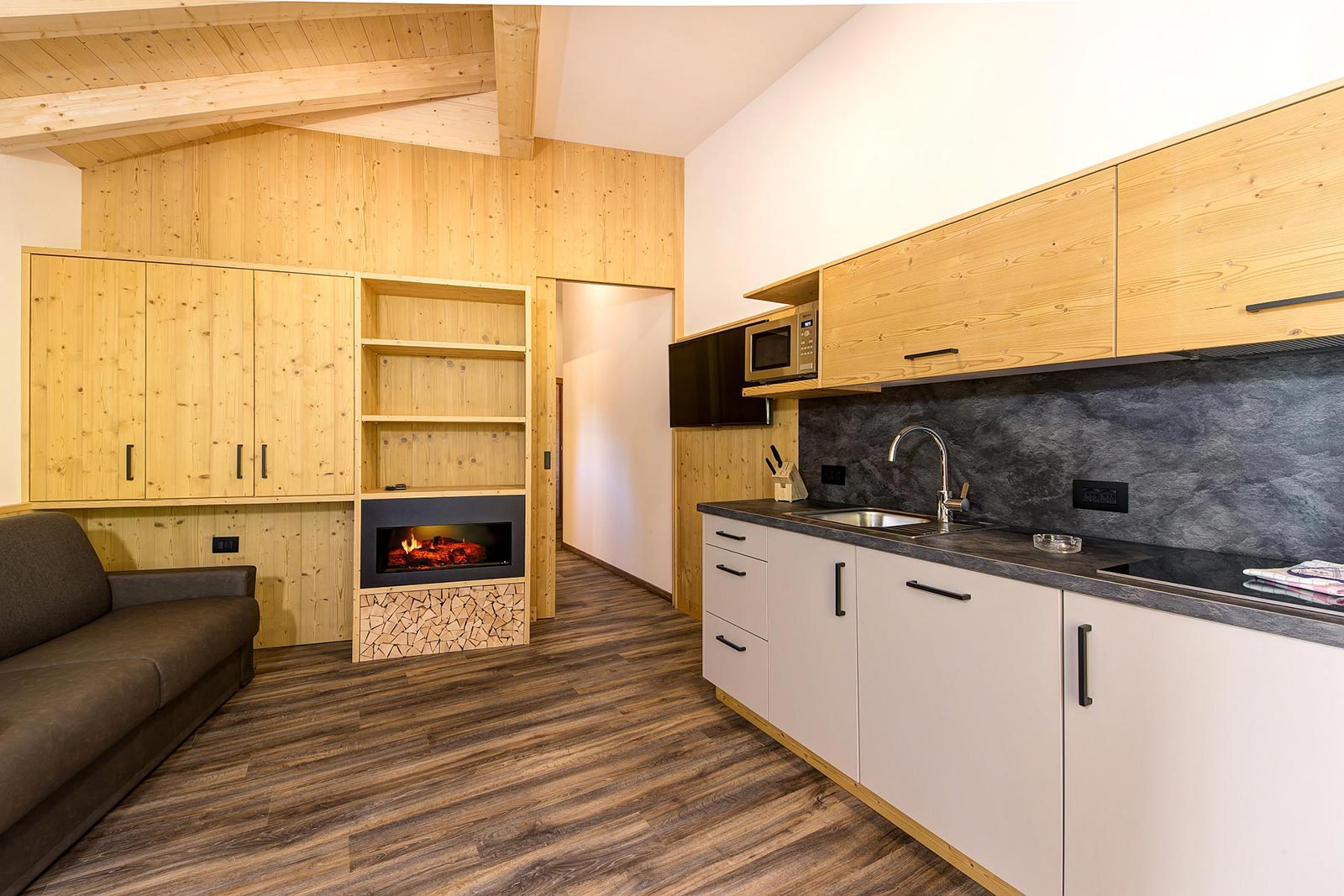 View of the kitchen and a living room of the accomodation in South Tyrol