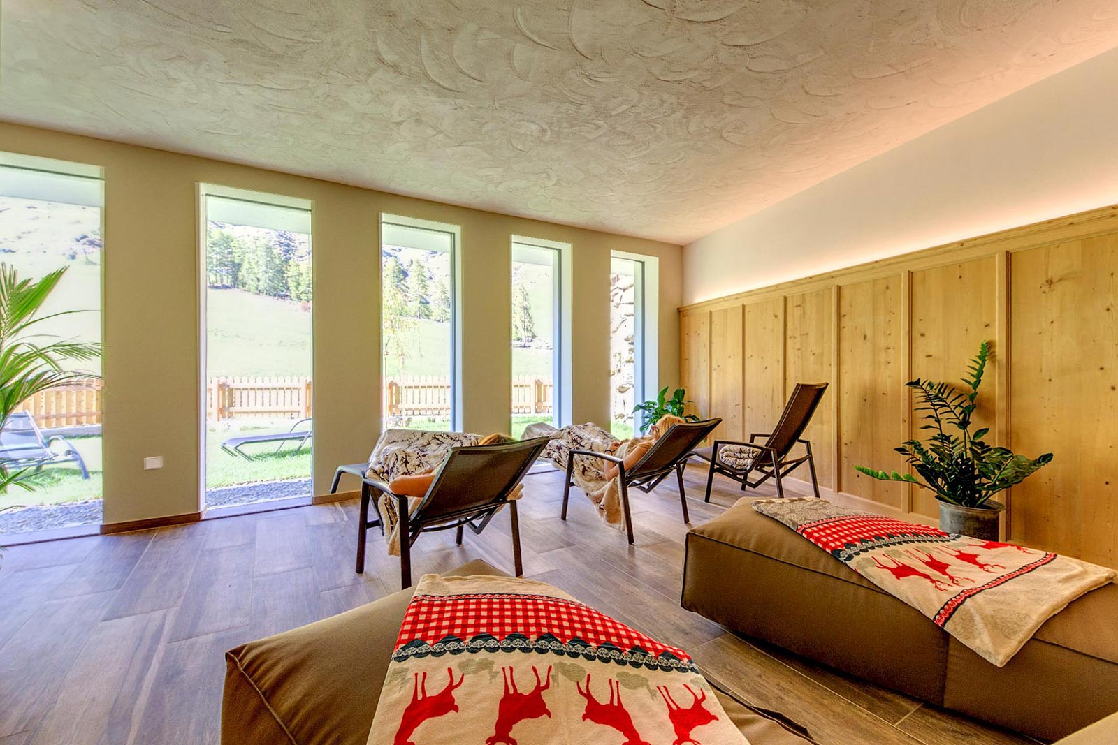 Two girls take a break on the beds in the wellness area of the Residence