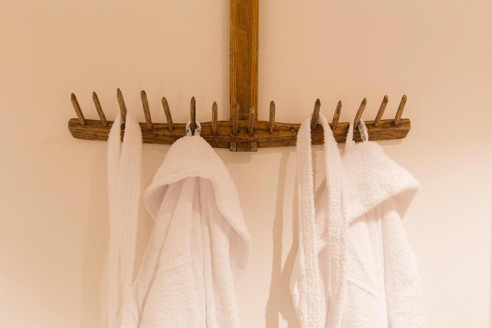 Detail of two bathrobe in the entrance to the wellness centre of the Residence Marteshof